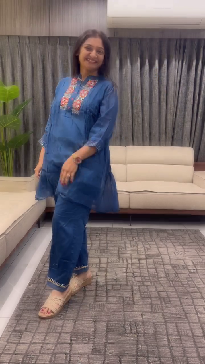 Women Floral Embroidered Cotton Kurta with Trousers